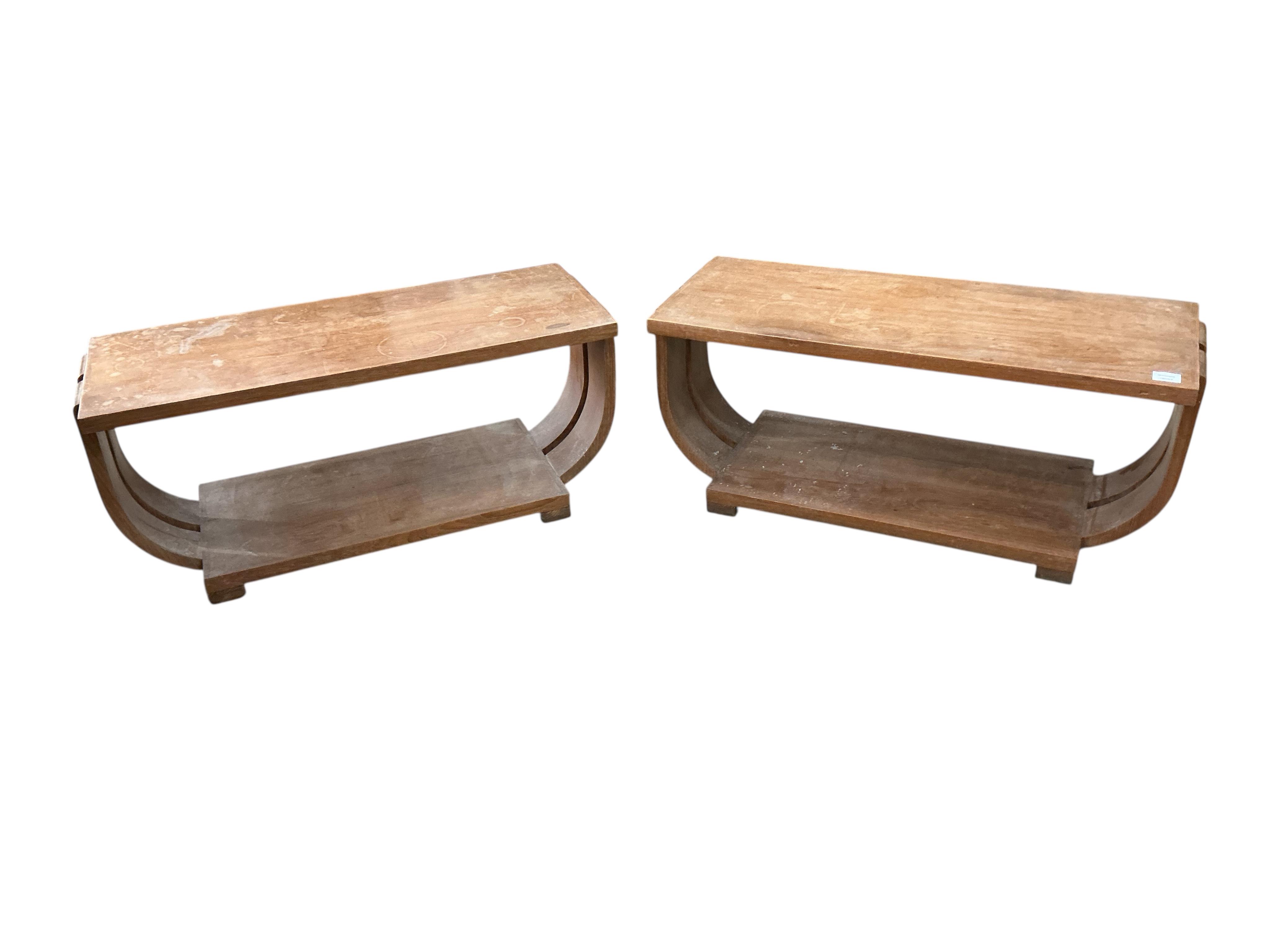 A pair of Art Deco rectangular maple occasional tables in the manner of Gilbert Rohde for Saltman-Brown, width 95cm, depth 37cm, height 41cm
